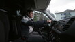© Marco - Woman driving truck, interior perspective of a female driver drives large vehicle, hands on steering wheel