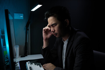 Poster - Stressed, tired business man suffering from headache, working late night in the office. Worried male entrepreneur thinking about problems and project deadline feeling burnout, stress and exhausted