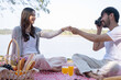 © MIND AND I - Couple having a picnic in a beautiful and natural park