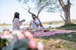 © MIND AND I - Couple having a picnic in a beautiful and natural park