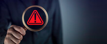 Red Triangle Caution In Magnifier Magnifying. Businessman Hold Magnifier Magnifying Focus Alert Danger Warning Icon Sign For Notification Error And Maintenance.