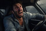 Fototapeta  - A picture of a man with his mouth open in a car. This image captures the surprise or shock on the man's face. It can be used to depict reactions, emotions, or unexpected situations.