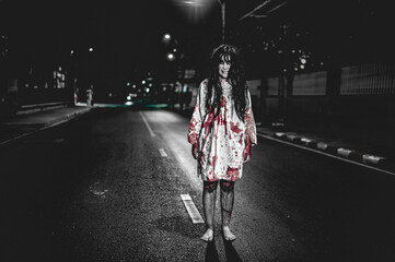 Horror woman concept,Ghost on the road in the city,A vengeful spirit on the street of the town,Halloween festival,Make up ghost face