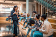 © Marko Geber - Young and diverse group of students having a conversation in the university lobby