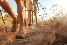 Close-Up Of Hikers Feet Trekking In Natural Terrain