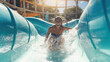 A happy person riding on the water slide in the waterpark