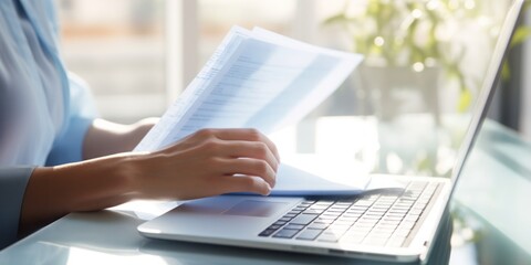 Aufkleber - Efficient Digital Workflow: A Closeup of a Womans Hands Holding Papers in Front of Her Laptop, Showcasing Digitization, Scanning, Paperwork Management, Administrative Efficiency, Personnel Oversight