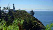 Ancient Lighthouse Post On Oregon Coast Cliffside