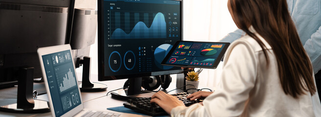 Poster - analyst working on data analysis or bi dashboard on computer monitor. business team analyzing financ