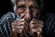 An elderly widower in his 80s, his face and hands marked with wrinkles and a sense of sadness. Despite the grief and loss hes experienced, his wrinkles also reflect a life welllived, filled