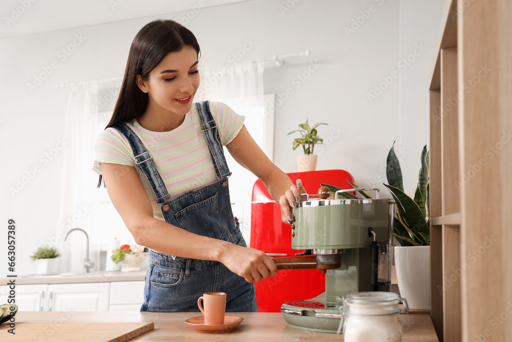 Young woman making coffee in kitchen