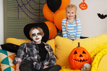 Wall Mural - Little children celebrating Halloween at home