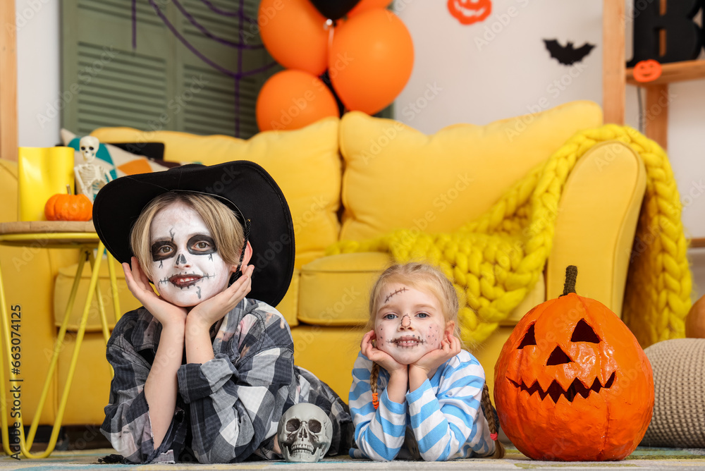 Little children celebrating Halloween at home