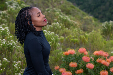 Wall Mural - Women seen meditating in nature