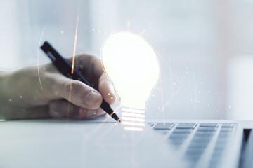 Poster - Creative idea concept with light bulb illustration and hand writing in notebook on background with laptop. Multiexposure