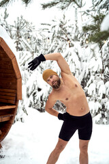 Wall Mural - Caucasian man warming up before winter swim