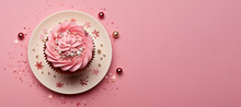 Сhristmas Cupcake On The Plate With Dragee And Confetti On Pink Background With Copy Space