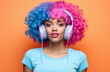 © JuanM - Young African American woman with vibrant pink curly hair wearing retro clothes