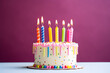 © May - Birthday cake with candles on magenta background