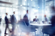 blurred businessmen in an office with colleagues talking, back button focus