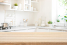Wooden Table Top View For Product Montage Over Blurred Kitchen Interior Background