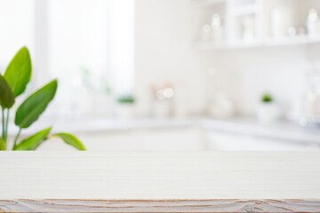 Wall Mural - empty wooden table top counter and blur modern kitchen interior background