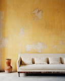 Fototapeta  - Old beige sofa against aged grunge ancient weathered yellow stucco wall with copy space. Vintage, retro home interior design of living room.