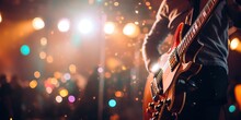 Music Holiday Composition With Close Up Electronic Guitar On Blurred Concert Background With Bokeh Effect.