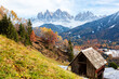 Autumn rural mountain landscape  with at аgricultural barn for hay  in the foreground, Val di Funes,  Dolomite Alps,  South Tyrol, Italy.