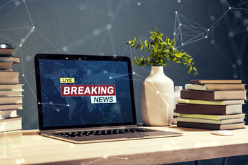 Poster - Close up of laptop computer at workplace with different objects and creative polygonal breaking news and globe hologram. Television, online news and digital communication concept. 3D Rendering.