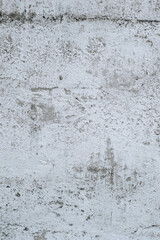 Wall Mural - Gray stained concrete wall, dirty cracked uneven cement surface with paint close-up. Photography, abstraction, background.