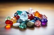 a pile of assorted colored gemstones on a table