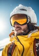 © Glittering Humanity - A vibrant winter portrait captures a man in a yellow jacket, adorned with goggles and snow, as he embraces the beauty of the season while skiing under a clear sky