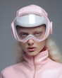 © Glittering Humanity - A stunning winter portrait of a woman, adorned in a ski mask and pink and white goggles, exuding both strength and femininity, as she gazes confidently into the camera from an indoor setting