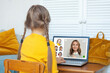 © millaf - Little girl studying online and talking to the teacher