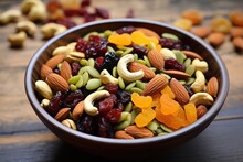 A Bowl Of Mixed Nuts And Dried Fruit