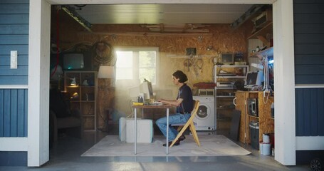 Leinwandbilder - Caucasian Male Software Engineer Programming On Old Desktop Computer In Retro Garage With Random Appliances. Man Working On Innovative Fintech Startup Company In Nineties. Nostalgia Concept.