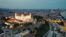 Bratislava castle on the hill over Danube river at twilight, Slovakia