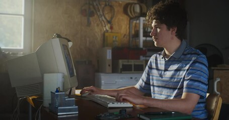 Fototapete - Caucasian Male Software Developer Programming On Old Desktop Computer In Retro Garage. Enthusiast Browsing Early Internet Forums, Coding Applications, Chatting Online In Nineties. Nostalgia Concept.