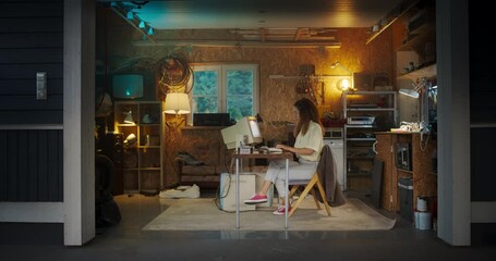 Fototapete - Hispanic Female Developer Programming On Old Desktop Computer In Retro Garage In The Evening. Young Woman Working On Innovative Online Service Startup Company In Nineties. Nostalgia Concept.