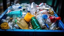 a pile of unsorted recycling in a plastic container 