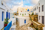 Fototapeta Uliczki - Narrow streets of Kastro village with traditional architecture at sunrise time on Sifnos island, Cyclades, Greece
