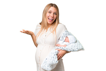 Wall Mural - Young pretty pregnant woman with her newborn baby over isolated chroma key background with shocked facial expression