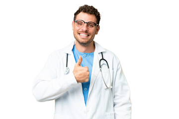 Wall Mural - Brazilian doctor man over isolated chroma key background giving a thumbs up gesture