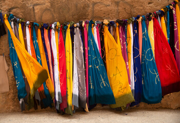 Wall Mural - Many colourful Moroccan scarves with berber symbols