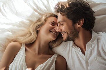  lovely caucasian couple on bed peacefully sleeping looking at each other and smiling