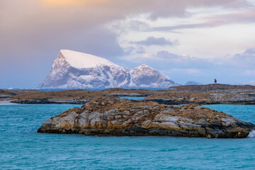 Wall Mural - Sommaroy islands and arctic sea near Tromso Norway. Sunset over snowy small islands