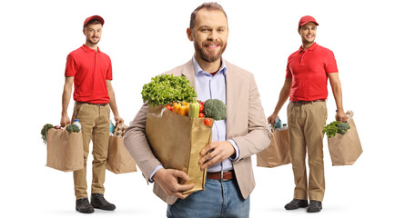 Wall Mural - Customer and delivery men holding bags with groceries