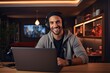 © mariof - Portrait of a happy young man in headphones using laptop at home ai generative