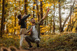 © bernardbodo - Father and daughter blowing bubbles in the woods